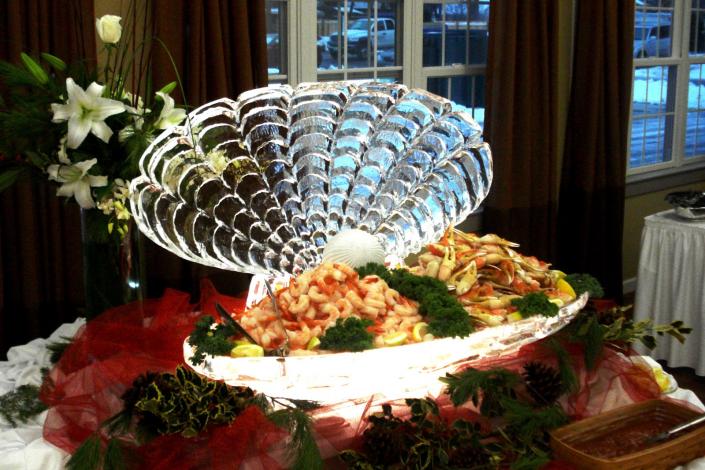 This is an example of a function ice sculpture used as a seafood display. Keep your food cold and draw attention with a custom ice sculpture from Krystal Kleer Ice Sculptures, LLC. Functional Display work beautifully for seafood, fruit and/or vegetables at any corporate or private event!