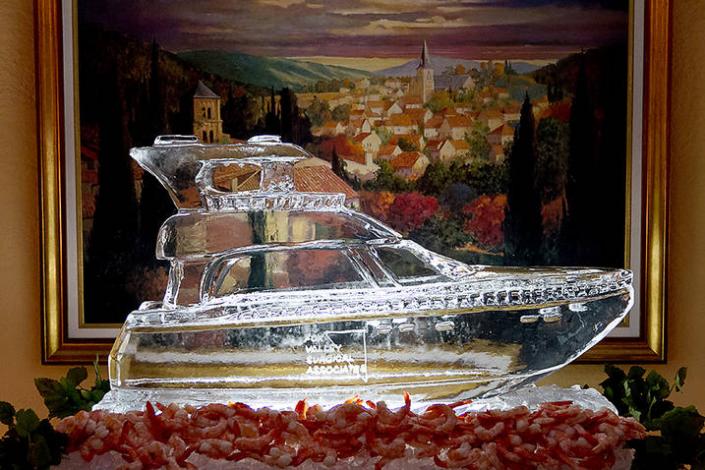 Adding a custom ice sculpture to your event is a great way to add elegant detail and really enhance your brand image. Feature your logo or a locally trademark near the food table to have them coming back for more. This piece was a custom Yacht for a retirement party.
