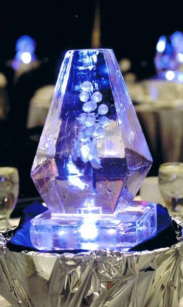 Krystal Kleer Ice Sculptures, LLC can incorporate your favorite flowers, colors, and theme into unique mini centerpieces. Contact us today to learn more. 