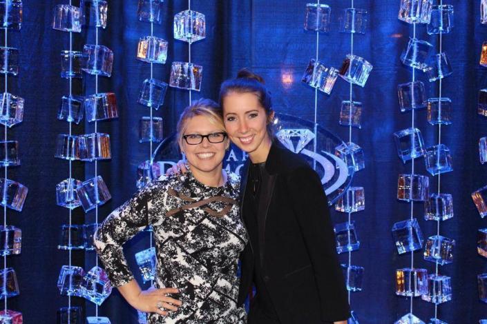 The "Ice Curtain" backdrop at the Taste of Wine and Cheese, with Allison Kline and Amanda Gay, made possible with the production help and guidance of Art Below Zero.